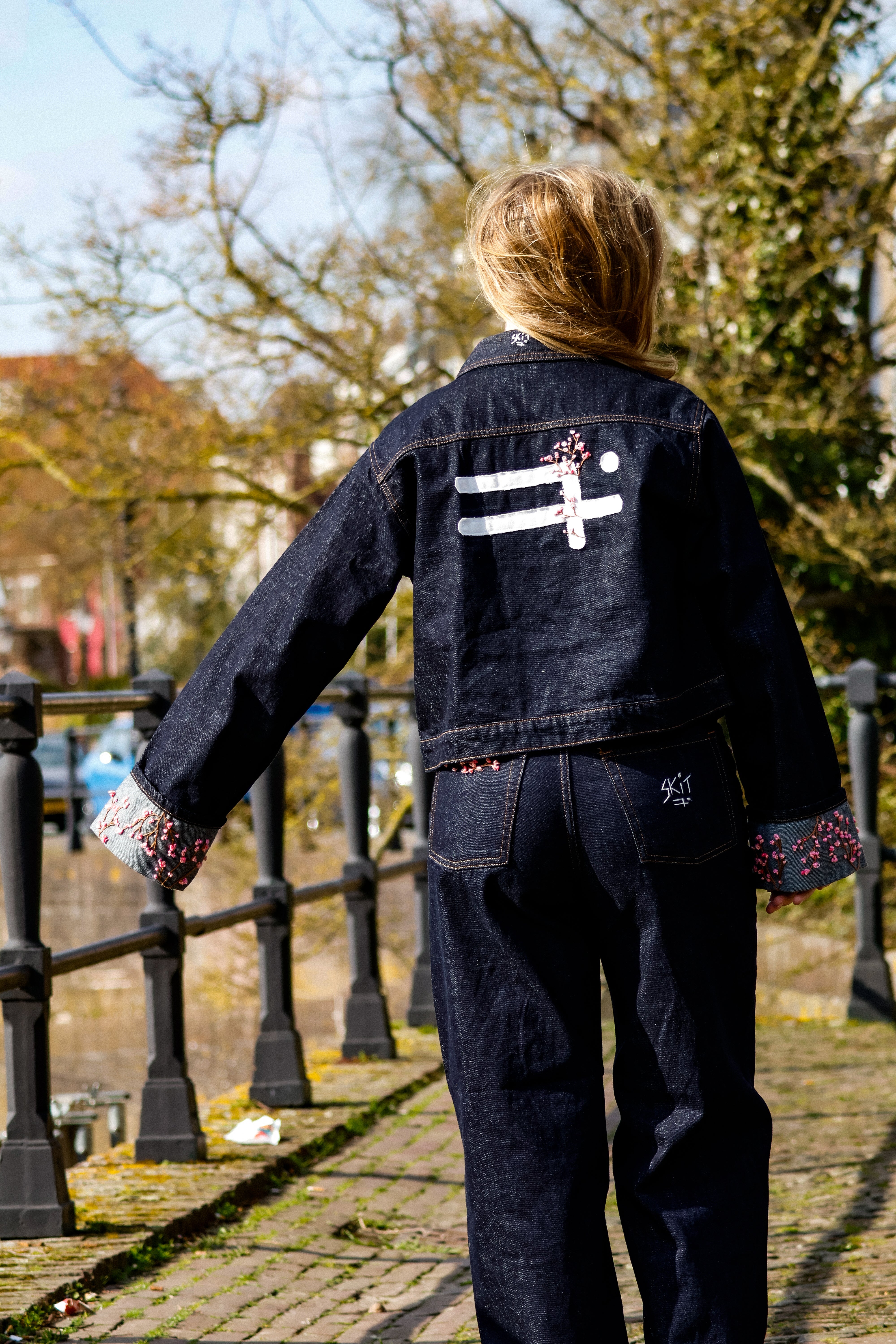"RESIIISTANCE" denim suit