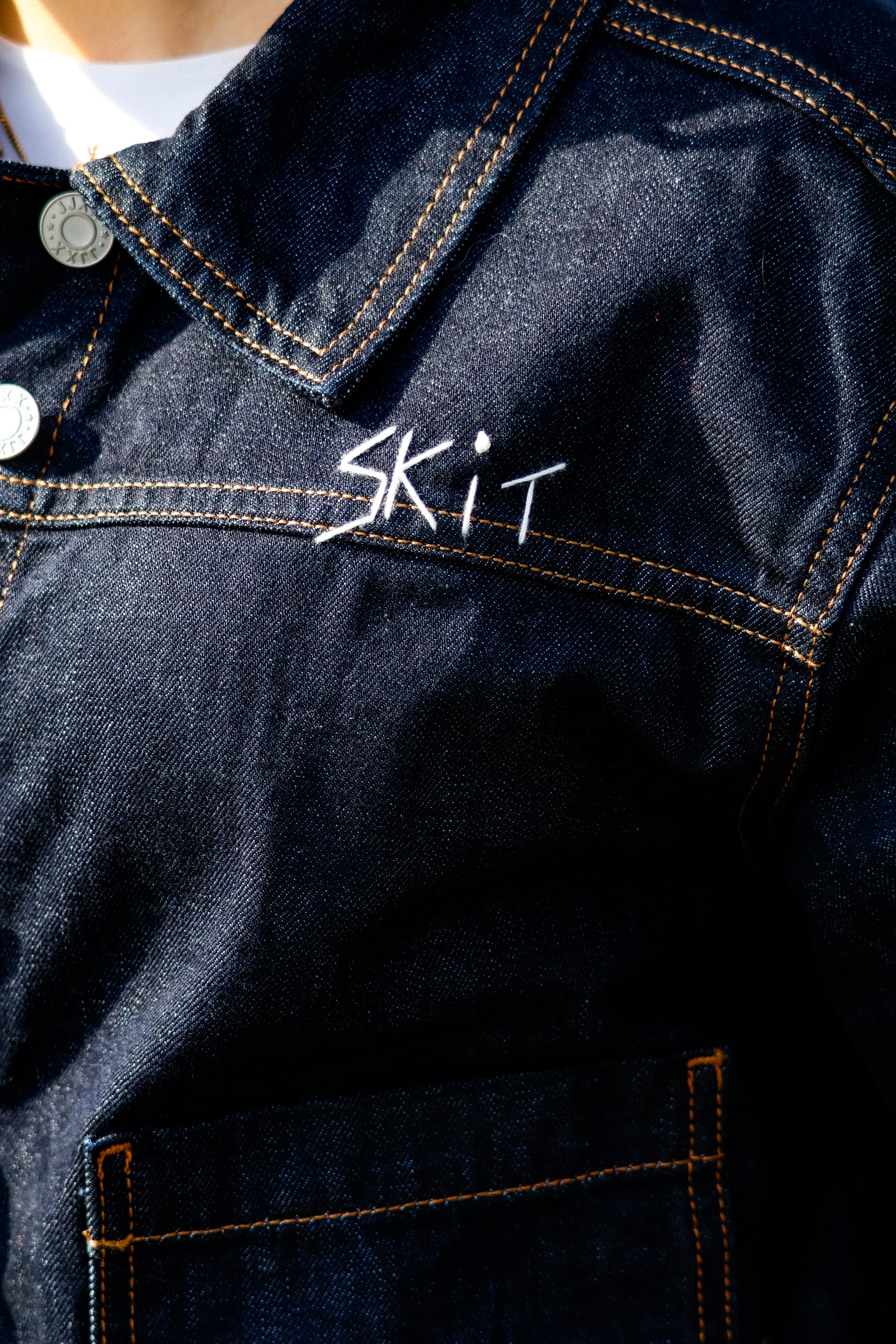 "RESIIISTANCE" denim suit